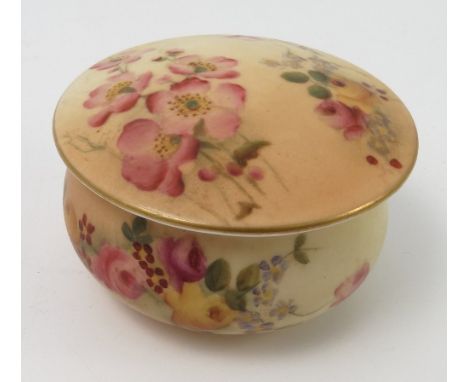 A Royal Worcester blush ivory circular patch box and cover, decorated with flowers, dated circa 1916, diameter 2.5ins
