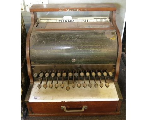 A Gledhill Halifax shop till, in mahogany and enamel, with marble top to drawer 