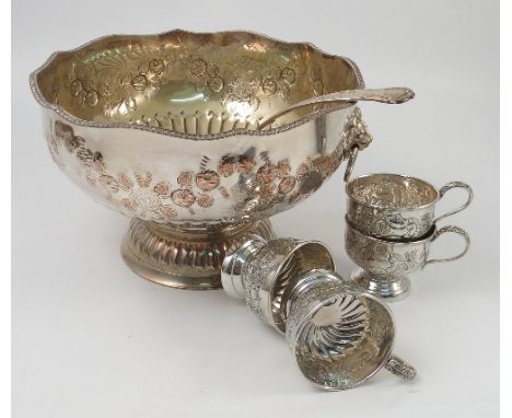 A silver plated punch set, comprising pedestal bowl, with gadrooned edge and a pair of lion mask and ring handles, a punch la