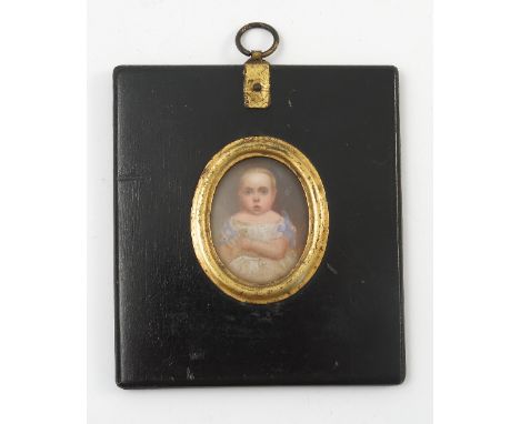 A 19th century portrait miniature, of a young child in white dress with blue ribbon, maximum diameter 1.5ins