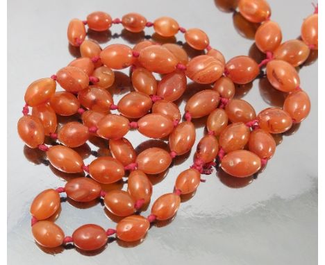 A string of graduated agate beads, together with a 19th century cameo brooch carved with a classical portrait and a dove with