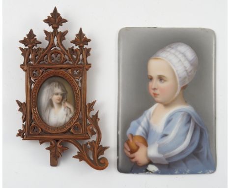 A 19th century portrait miniature, painted on porcelain, of a young child wearing a bonnet, with paper label verso Angiolo Va