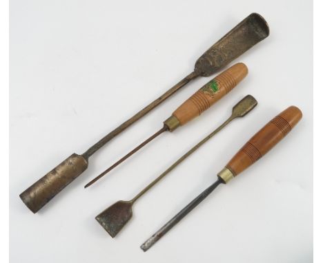 A collection of wood working tools, including chisels with turned wooden handles etc