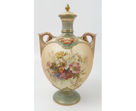 A Royal Worcester blush ivory covered vase, decorated with flowers to a globular body, with ornate mask moulding, cover assoc