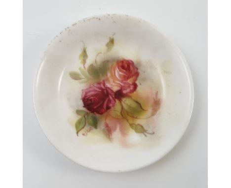 A Royal Worcester pin dish, hand painted with roses K Blake, dated 1928, diameter 4ins