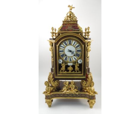An Antique red tortoiseshell and ormolu bracket clock, with circular enamelled dial, inscribed Benjamin Gray and Justin Vulli