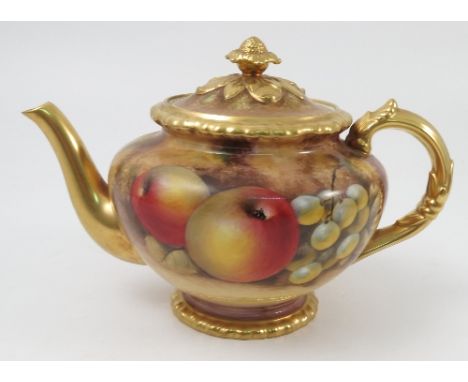 A Royal Worcester tea pot, hand painted with fruit to a mossy background by J Smith, height 6.5ins