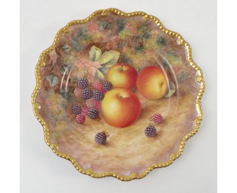 A Royal Worcester cabinet plate, decorated with fruit to a mossy background by H Ayrton, with shaped gilt edge, diameter 9ins