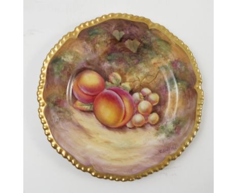 A Royal Worcester side plate, decorated with fruit to a mossy background by C Smith, with shaped gilt edge, diameter 5.75ins