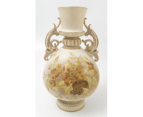 A Royal Worcester gilded ivory vase, decorated with yellow and gilt flowers, with scroll handles, shape number 1431, dated ci