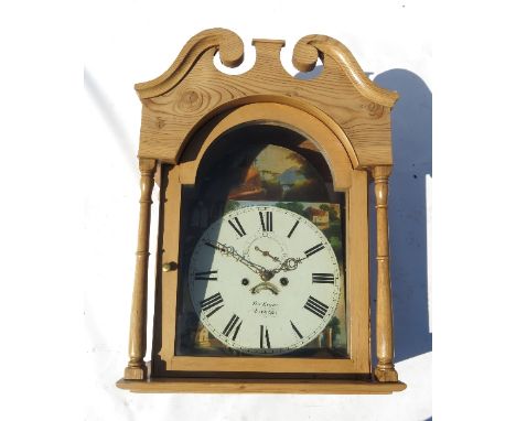 A pine long case clock, the arched painted dial decorated with landscape scenes and having second hand sweep and date apertur