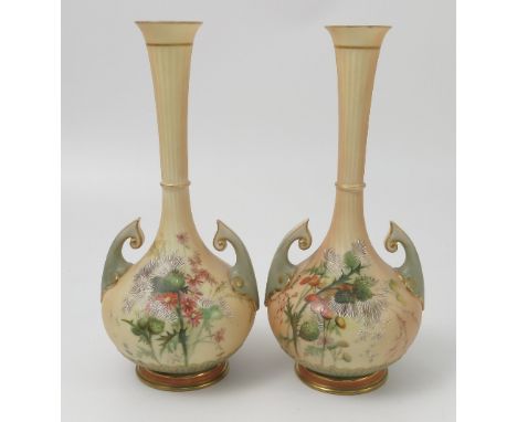 A matched pair of Royal Worcester blush ivory vases, decorated with thistles and flowers, having turquoise handles, shape num