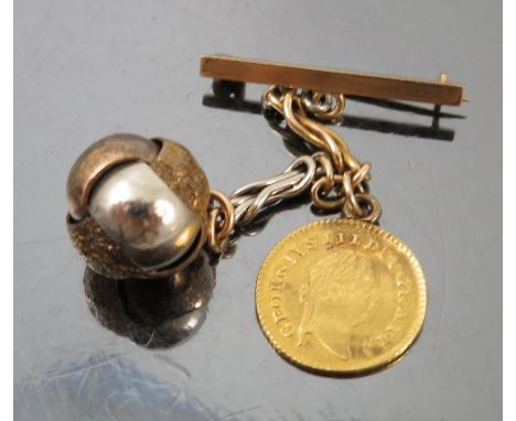 A Third Guinea, dated 1799, with pendant fitting, set on a fancy link chain with knot ball and bar brooch
