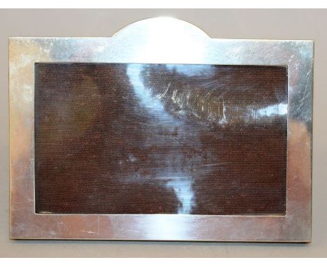 A RECTANGULAR EASEL PHOTOGRAPH FRAME with serpentine top. 4.5ins high x 6ins wide. Birmingham 1949.