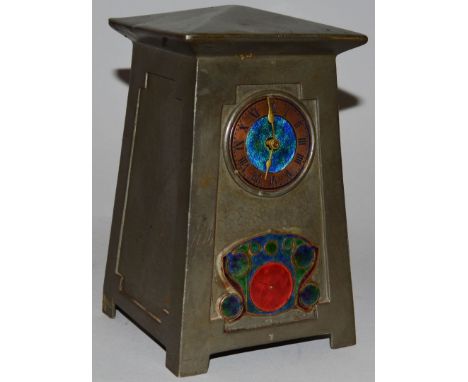 A LIBERTY & CO ENGLISH PEWTER AND ENAMEL CLOCK designed by ARCHIBALD KNOX, model 0629, tapering rectangular body, the front w