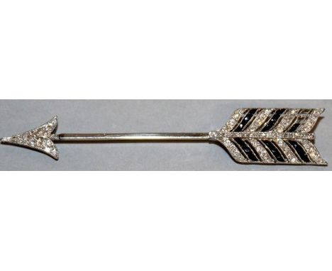 AN ART DECO DIAMOND AND RUBY BROOCH in white gold in a BOUCHERON of PARIS, GENEVA AND LONDON box. 