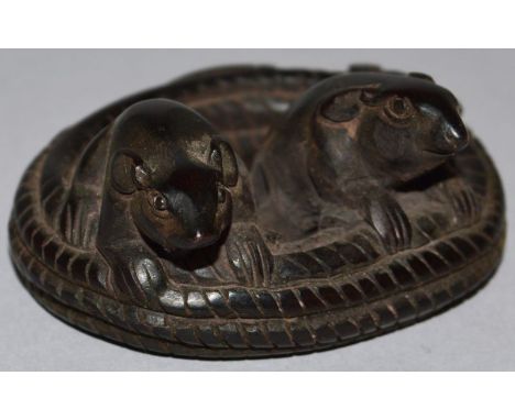 A CARVED WOOD NETSUKE, two rats on a snake. 