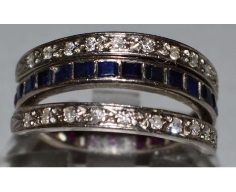 A TRIPLE ROW FOLDOVER RING. 