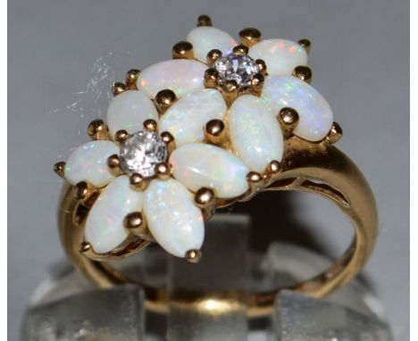 A GOOD DOUBLE OPAL AND DIAMOND FLOWER RING set in 9ct yellow gold. 