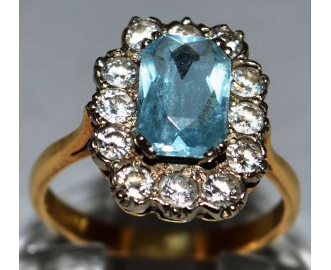 AN AQUAMARINE AND DIAMOND CLUSTER RING set in 18ct white gold. 