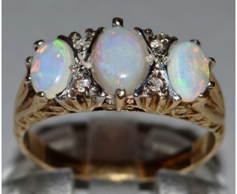 AN OPAL AND DIAMOND RING set in 9ct yellow gold. 