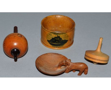 TWO TREEN SPINNING TOPS, Mauchelin “Mont St-Michel” serviette ring and small carved elephant spoon. 