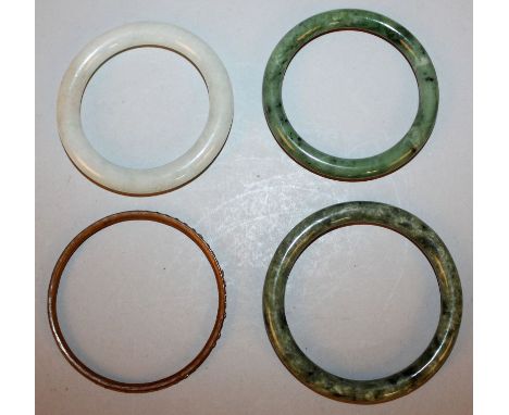 THREE CHINESE JADE-LIKE BANGLES, 3.25in diameter & smaller; together with a paste bangle, 2.9in diameter. (3) 