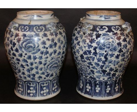 A PAIR OF 19TH CENTURY CHINESE BLUE & WHITE PORCELAIN JARS, each painted with a formal design of leaf and scroll stemmed peon