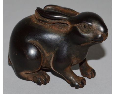 A CARVED WOOD NETSUKE, a rabbit. 