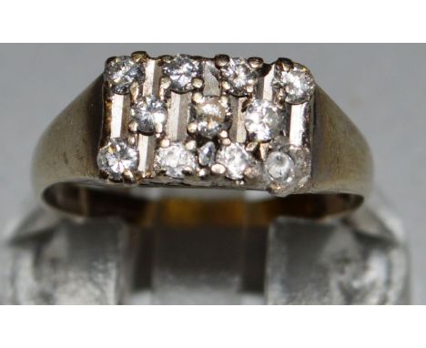 AN 18ct WHITE GOLD AMD DIAMOND THREE ROW RING. 