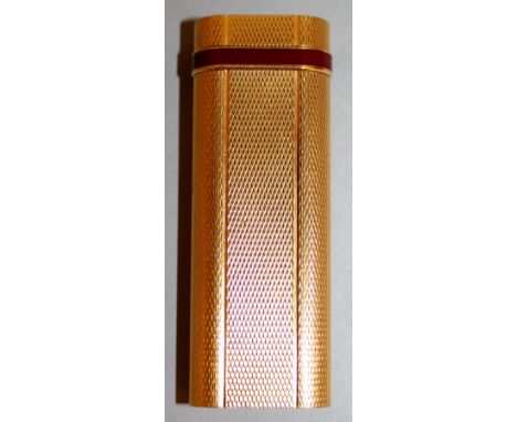 A CARTIER GOLD COLOURED ENGINE TURNED GAS LIGHTER. No. 37209T. 