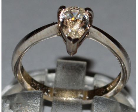 A GOOD SOLITAIRE DIAMOND RING, pear shaped, approx. .78cts, colour H-I/V.S., set in 18ct yellow gold. 