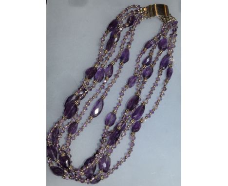 AN AMETHYST FOUR ROW PEARL NECKLACE with silver buckle clasp. 