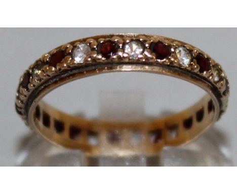 A GOLD ETERNITY RING. 