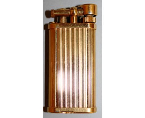 A DUNHILL GOLD COLOURED RIBBED GAS LIGHTER. No. 357331. 