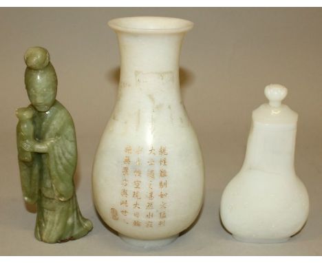 A CHINESE WHITE JADE-LIKE VASE & COVER, the sides decorated with taotie masks below stiff leaves, 5.7in high overall; togethe