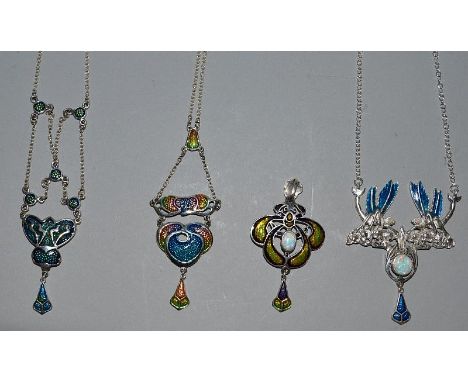 FOUR ART NOUVEAU DESIGN SILVER AND ENAMEL PENDANTS. 