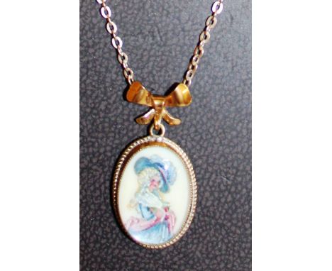 A GOLD CHAIN AND PORTRAIT PENDANT. 