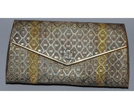 A LADIES CHRISTIAN DIOR TWO COLOURED GOLD EVENING BAG with mirrored interior and diamond set initials. 