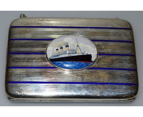 A SILVER AND BLUE ENAMEL CIGARETTE CARD CASE, Birmingham 1911, inset with an oval of a steam ship. 