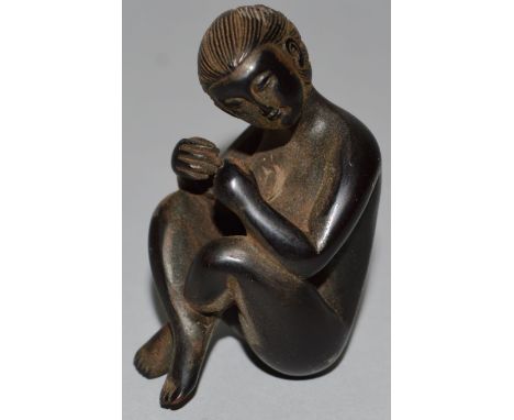 A CARVED WOOD NETSUKE, a nude woman. 