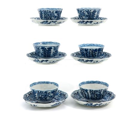 Floral decor, including Kangxi mark, saucers are 13 cm. in diameter.