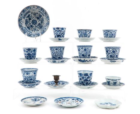 Including 10 cups and 14 saucers and a candlestick, some 18th Century, largest saucer is 16 cm. in diameter, chip and hairlin