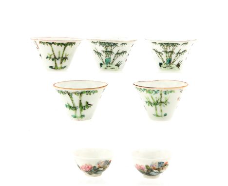 Polychrome decors, largest cup is 6 cm. in diameter. 