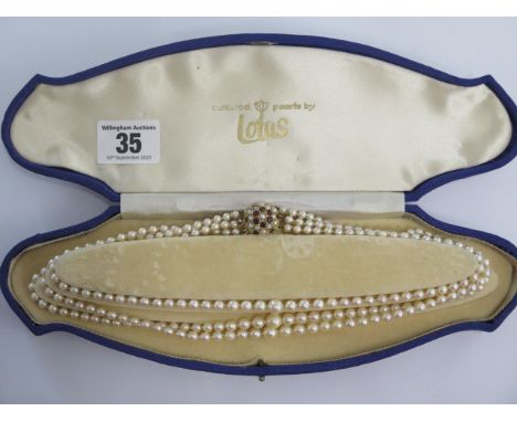 A triple string of Lotus cultured pearls with a 375 9ct clasp - Length 43cm - largest pearl approx 7mm - some blemishes but g
