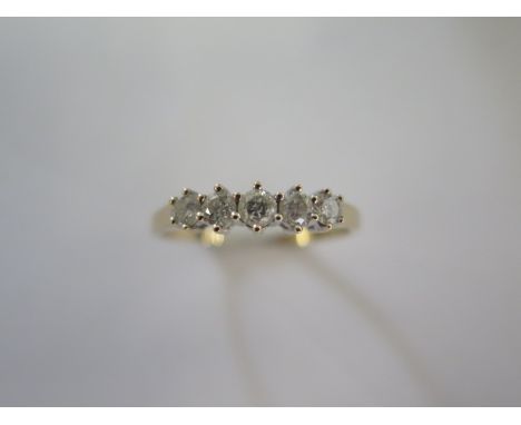 A 9ct yellow gold five stone diamond ring - approx 0.5ct of diamonds, diamond weight marked to the inside of the ring - head 