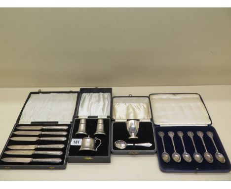 A boxed silver Christening set - no engraving - a boxed set of silver handle knives, a boxed set of silver miniature Rifle Cl