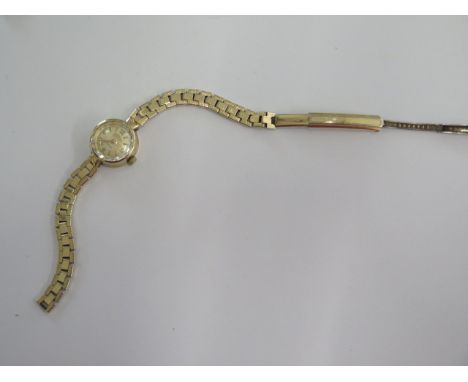 A 9ct yellow gold Rotary manual wind ladies wristwatch on a rolled gold strap - running 