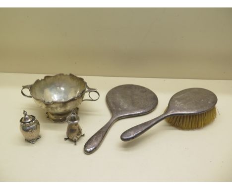A silver twin handle bowl - Width 18cm - two silver cruet, a silver back brush and mirror - weighable silver approx 8.9 troy 