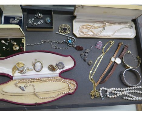 A collection of assorted costume jewellery and watches including a silver bangle 